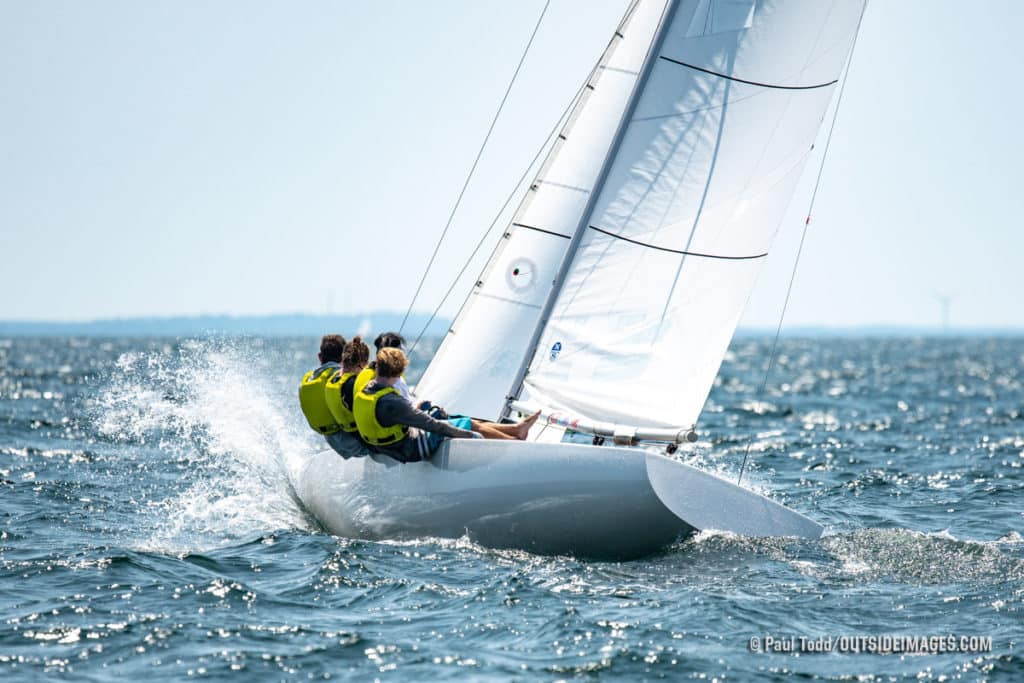 Bradley Adam steers upwind on the second race of the day at the Helly Hansen NOOD Regatta at Marblehead Race Week