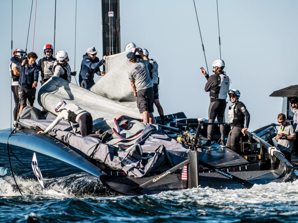 Raising the mainsails of the AC75 American Magic