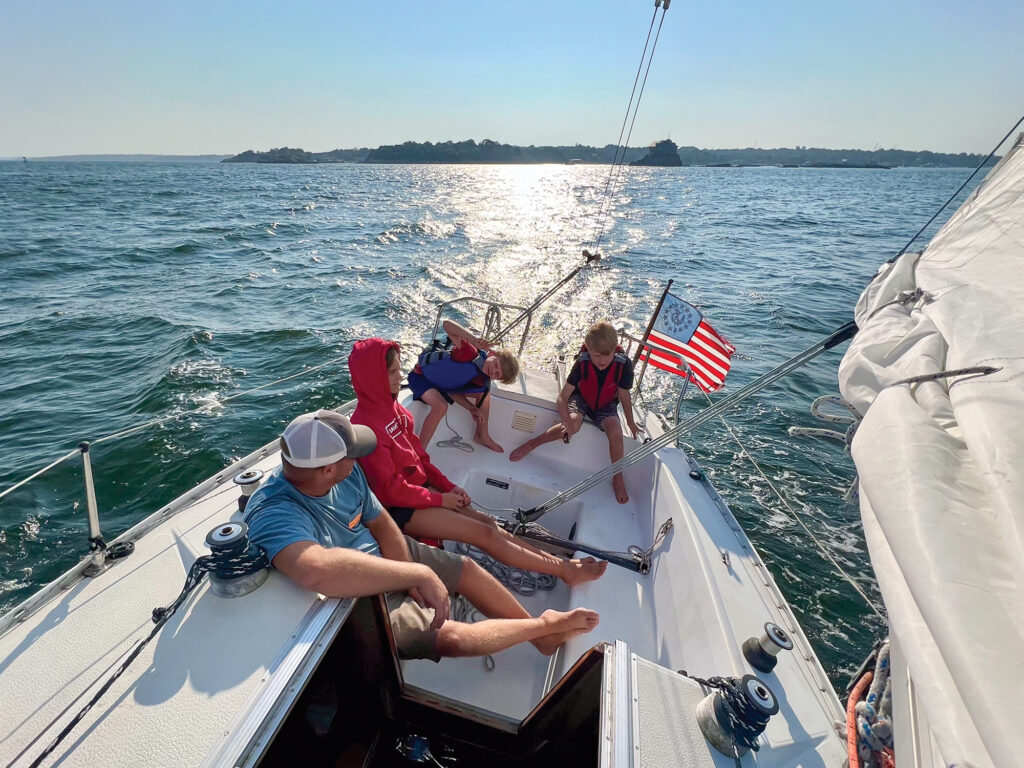 Reed with family on their boat, Another Opinion